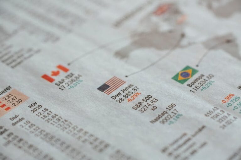 Economists analyzing charts and graphs in a会议室, focusing on recession indicators to forecast economic downturns.