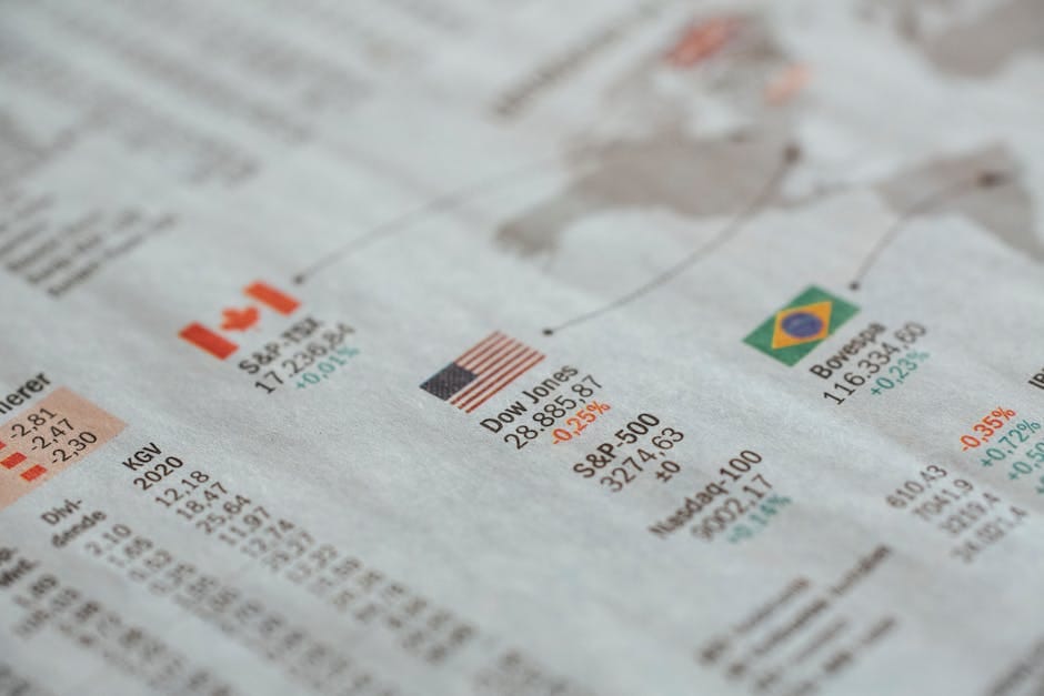 Economists analyzing charts and graphs in a会议室, focusing on recession indicators to forecast economic downturns.